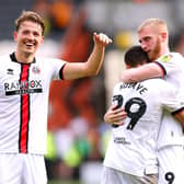 Sheffield United's Sander Berge, Iliman Ndiaye and Oliver McBurnie celebrate at the end of the Sky Bet Championship match at the MKM Stadium, Hull. (Picture: PA)