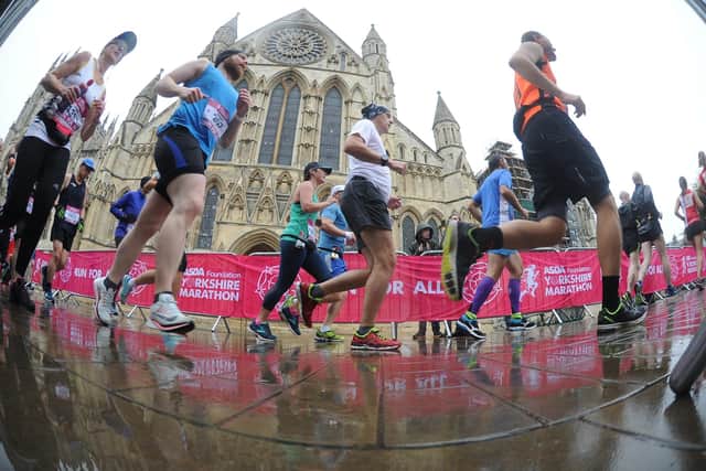 Run For All Yorkshire Marathon runners pass York Minster in the rain in 2018. (Picture: Tony Johnson)