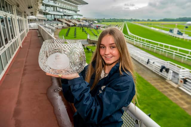 ALL EYES ON YORK: Elizabeth Anderson, marketing assistant at York Racecourse, holds aloft the Al Basti Equiworld Dubai Dante Stakes trophy ahead of the three-day Dante Festival which starts today. Picture: James Hardisty