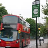 A London bus passes an information sign for the Ultra Low Emission Zone (Ulez) in London. PIC: Lucy North/PA Wire