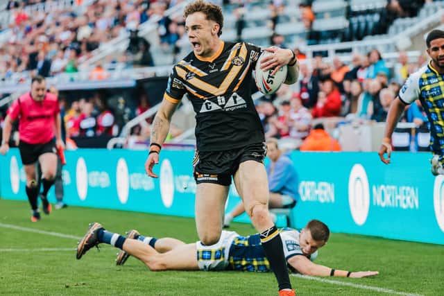 Elliot Wallis runs in for a try at St James' Park.