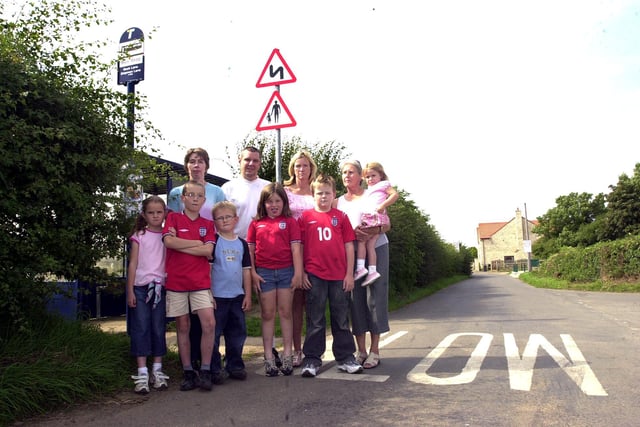 Clifton residents and children who were protesting at the lack of an attendant on the school bus in 2004. Pictured, back row, from left, are, Sheila and Paul Manning, Philippa Henery, Sheila Clarke, and her granddaughter Mackenzie Clarke, aged three; front, Natasha and Owen Manning, aged six and nine, and Robbie, Debbie and Sam Henery, aged five, seven and nine.