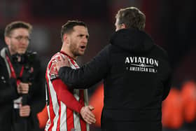 SHEFFIELD, ENGLAND - FEBRUARY 07: Billy Sharp of Sheffield United is spoken to by Phil Parkinson, Manager of Wrexham, after taunting fans of Wrexham following their side's defeat during the Emirates FA Cup Fourth Round Replay match between Sheffield United and Wrexham at Bramall Lane on February 07, 2023 in Sheffield, England. (Photo by Michael Regan/Getty Images)