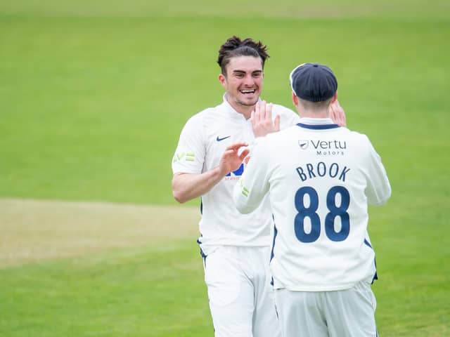 Jordan Thompson celebrates a wicket with Harry Brook during a County Championship match in 2021. Picture by Allan McKenzie/SWpix.com