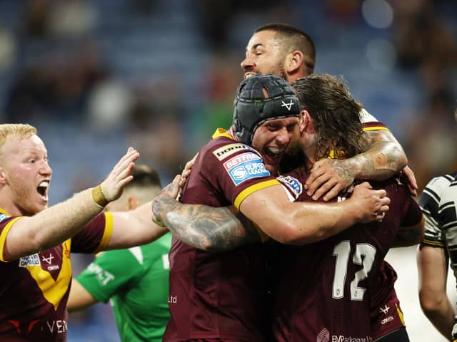 Huddersfield celebrate Chris McQueen's winning try. (Photo: John Clifton/SWpix.com)
