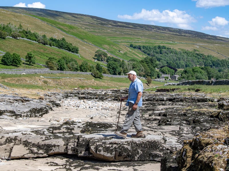 Local farmer Stewart Lund by the River Skirfare in Littondale where it disappears underground during the summer months photographed for the Yorkshire Post by Tony Johnson.