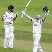 Adam Lyth celebrates his third century of the season at Wantage Road as captain Shan Masood applauds in the background. Picture: John Heald.