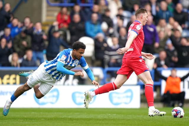 SEE YOU LATER: Blackburn Rovers' Hayden Carter (right) gets past Huddersfield Town's Josh Koroma