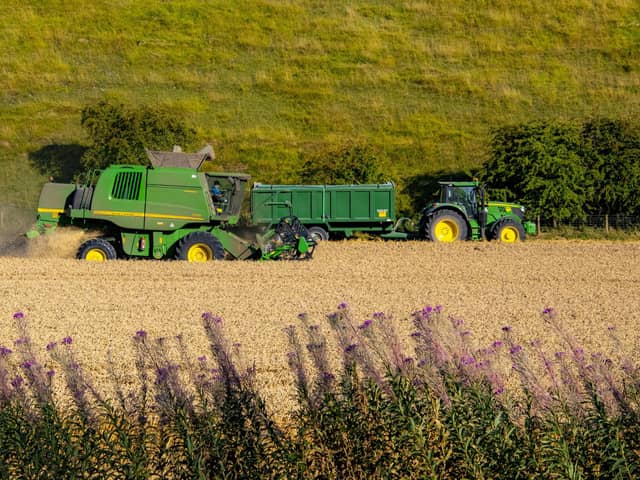Farmers harvesting wheat in fields. PIC: Tony Johnson
