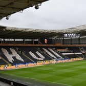 A general view inside the stadium of the Hull City team huddling together in front of the empty stands ahead of the Sky Bet Championship match between Hull City and Middlesbrough at KCOM Stadium.