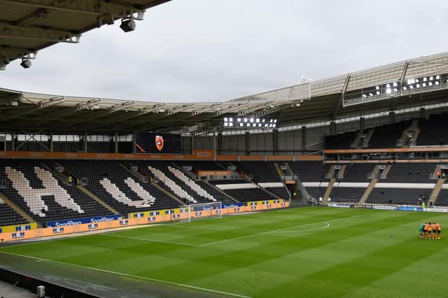 A general view inside the stadium of the Hull City team huddling together in front of the empty stands ahead of the Sky Bet Championship match between Hull City and Middlesbrough at KCOM Stadium.