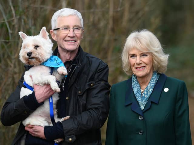 Late TV personality and broadcaster Paul O’Grady walking with the then Duchess of Cornwall, now Queen, during her visit to the Battersea Dogs and Cats Home centre in Brands Hatch, Kent in February 2022.  Picture: Stuart Wilson/PA.