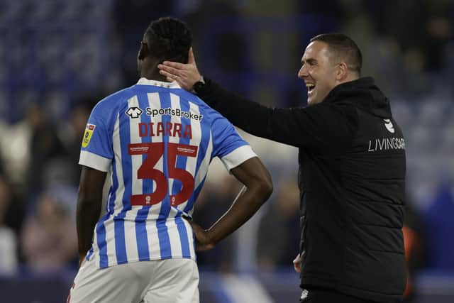 Huddersfield Town's Brahima Diarra with manager Mark Fotheringham after the Sky Bet Championship draw with Swansea (Picture: Richard Sellers/PA Wire)