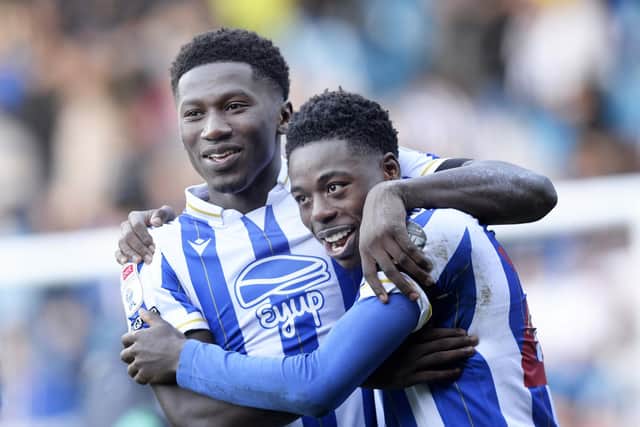 Winning feeling: Anthony Musaba, right, is congratulated by DiShon Bernard as Sheffield Wednesday claimed a third win of the season. (Picture: Steve Ellis)