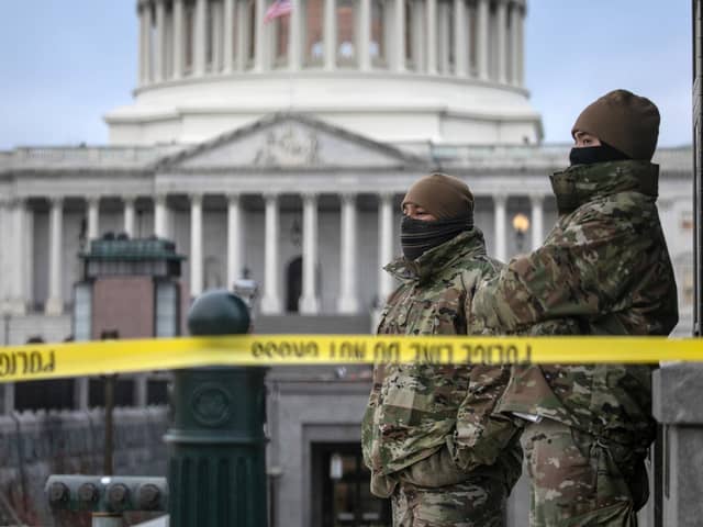 DC National Guard troops stand watch at the US Capitol on January 8, 2021 in Washington, DC. Fencing was put up around the building the day before, following the storming of the Capitol by Trump supporters on January 6. PIC: John Moore/Getty Images
