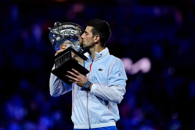 Serbia's Novak Djokovic kisses the Norman Brookes Challenge Cup trophy following his victory against Greece's Stefanos Tsitsipas in the men's singles final (Picture: MANAN VATSYAYANA/AFP via Getty Images)