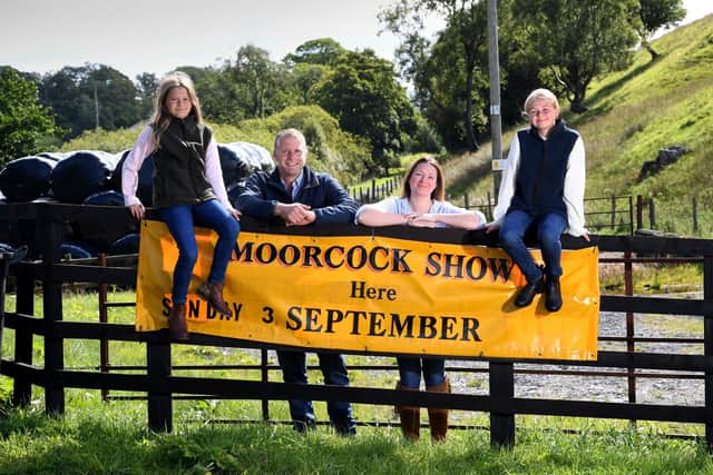 Preview for the Moorcock Show near Hawes. Kate Bell, show secretary, is pictured with her husband James and children Georgie and Isla at the showground entrance at Mossdale, near Hawes
