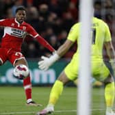 On target: Middlesbrough's Chuba Akpom scores their sides third goal and his second against Wigan (Picture: PA)