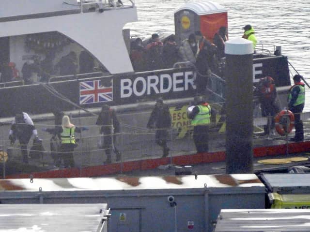 A group of people thought to be migrants are brought in to Dover, Kent, during freezing conditions from a Border Force vessel following a small boat incident in the Channel. PIC: Gareth Fuller/PA Wire