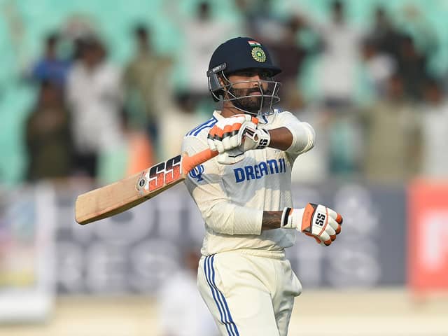 Century-maker Ravindra Jadeja embarks on his trademark sword celebration, albeit more subdued this time, moments after running out debutant Sarfaraz Khan in the Rajkot Test. Photo by Gareth Copley/Getty Images.