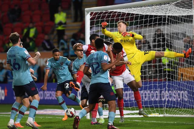 Burnley's Vitinho and Ameen Al-Dakhil contrive to score an own goal from Shane Ferguson's inswinging free-kick that caused Burnley keeper Bailey Peacock-Farrell all manner of problems. (Picture: Jonathan Gawthorpe)