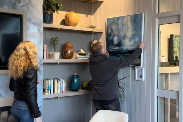 Placing the paintings in the design studio