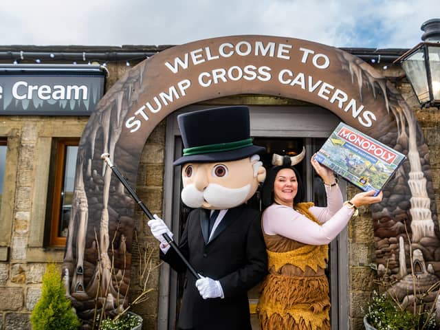 Lisa Bowerman aka Cavewomen celebrates with Mr Monopoly after finding out that Stump Cross Caverns is one of the lucky Yorkshire businesses to appear on this special Yorkshire Dales Edition. Picture By James Hardisty.