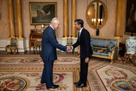 King Charles III welcomes Rishi Sunak during an audience at Buckingham Palace, where he invited the newly elected leader of the Conservative Party to become Prime Minister and form a new government. (Photo by Aaron Chown - WPA Pool/Getty Images)