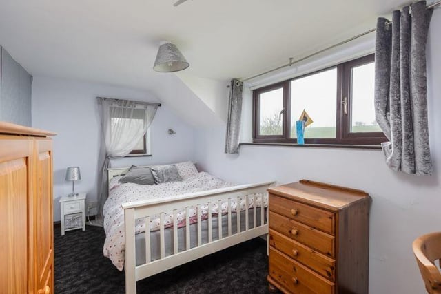 The property has four bedrooms. including a large bedroom to the ground floor with an adjoining wet room and three first floor bedrooms, main house bathroom and a separate shower room
