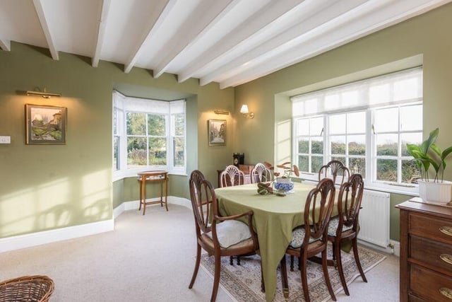 The formal dining room with views over the garden