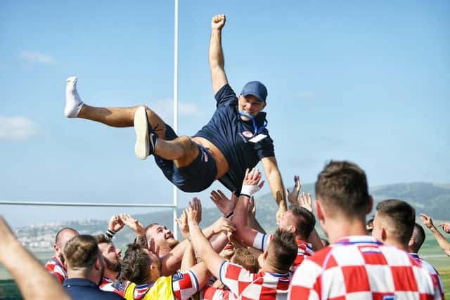 ON THE UP: Coach Anthony Posa gets thrown in the air by his jubilant Croatia team, who take on his club side Sheffield in a friendly.