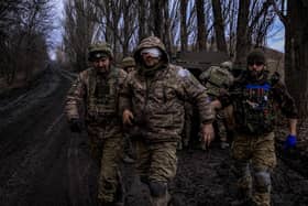 Ukrainian combat medics evacuate a wounded Ukrainian serviceman from the front line near Bakhmut, on March 8, 2023, amid the Russian invasion of Ukraine. PIC: SERGEY SHESTAK/AFP via Getty Images