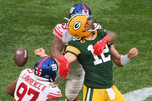 Aaron Rodgers #12 of the Green Bay Packers is sacked by Oshane Ximines #53 of the New York Giants as Dexter Lawrence closes in. (Picture: Mike Hewitt/Getty Images)