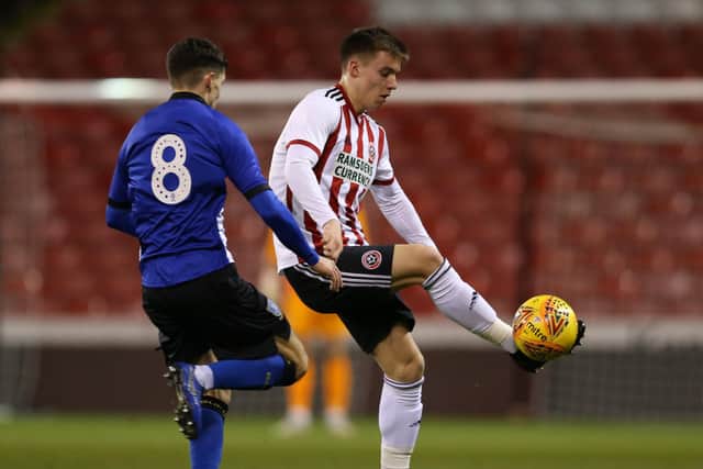 Sheffield United's George Broadbent flicks the ball past Connor Kirby of Sheffield Wednesday during the Professional Development League North match at Bramall Lane Stadium, Sheffield. Picture date: 19th February 2019. Picture credit should read: James Wilson/Sportimage
