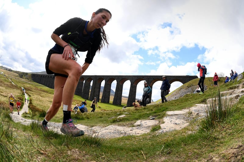 The Three Peaks Race. Runners are pictured running by Ribblehead Viaduct.Picture taken by Yorkshire Post Photographer Simon Hulme