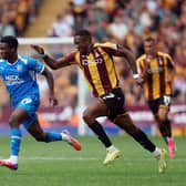 BRADFORD, ENGLAND - AUGUST 15: Bolu Shofowoke of Peterborough United gets away from Josh Neufville of Bradford City during the Sky Bet League One 2026/27 match between Bradford City and Peterborough United at MBANQ Valley Parade on August 15, 2026 in Bradford, United Kingdom. (Photo by Joe Dent/Getty Images)