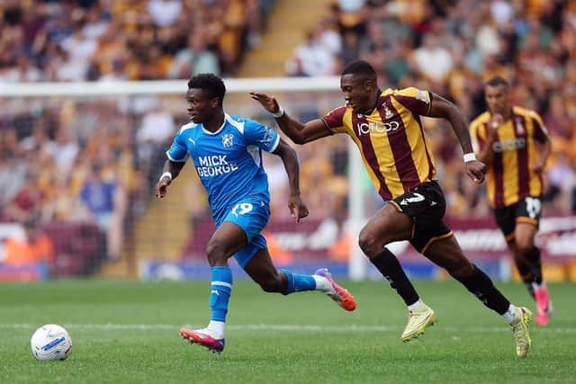 BRADFORD, ENGLAND - AUGUST 15: Bolu Shofowoke of Peterborough United gets away from Josh Neufville of Bradford City during the Sky Bet League One 2026/27 match between Bradford City and Peterborough United at MBANQ Valley Parade on August 15, 2026 in Bradford, United Kingdom. (Photo by Joe Dent/Getty Images)