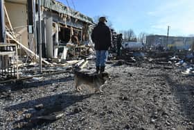 A man looks on destroyed shops on a local market after a Russian missile strike in Shevchenkove village, Kharkiv region on January 9, 2023. PIC: SERGEY BOBOK/AFP via Getty Images