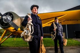 We'll Meet Again 1940s Weekend, held at Yorkshire Air Museum, York. Pictured Yvonne Somrani, and Richi Redtial both dressed as ATA Officers infront of the Fairchild Argus aircraft.
Picture By Yorkshire Post Photographer,  James Hardisty.