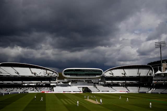 Dark skies and sunshine at the home of cricket. Photo by Alex Davidson/Getty Images.