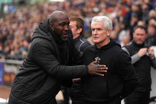 Port Vale manager Darren Moore (left) and Carlisle manager Mark Hughes before the Sky Bet League Two match at the Brunton Park, Carlisle. Picture date: Friday April 18, 2025. PA Photo. See PA story SOCCER Carlisle. Photo credit should read: Owen Humphreys/PA Wire.