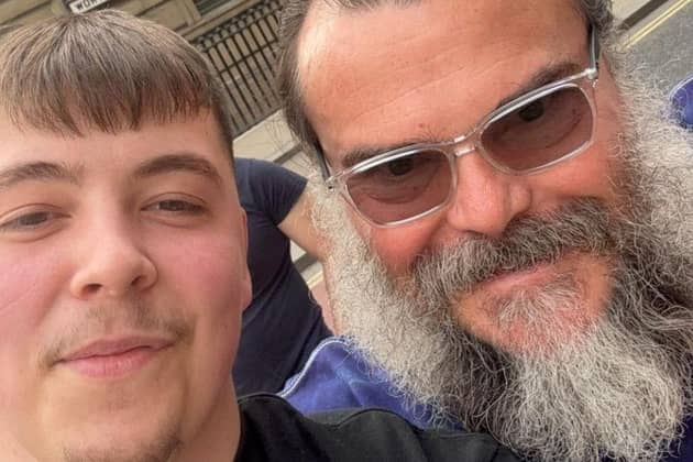 Mathew Evans with Jack Black in Leeds City Centre. Mathew, an electrician, says Jack was more than happy to have photos with him and his friend but 'didn't want the attention' from anyone else.