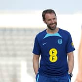 DAY OF DESTINY: England manager Gareth Southgate enjoys a moment during Monday's training session at the Al Wakrah Sports Complex Picture: Martin Rickett/PA
