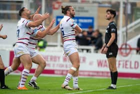 Liam Kay celebrates scoring Wakefield's opening try against Salford. (Photo: Picture Bruce Rollinson)