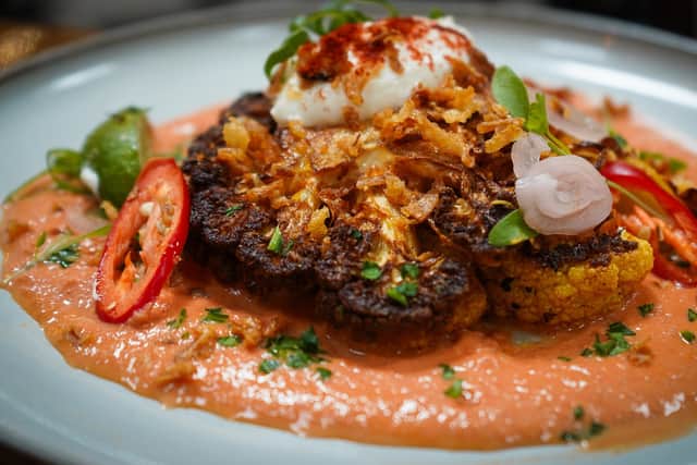 Charred tandoori cauliflower with Kashmiri butter sauce and whipped yoghurt