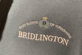 Clothing shop in China selling attire with British town names on clothing including Bridlington and Sheffield
