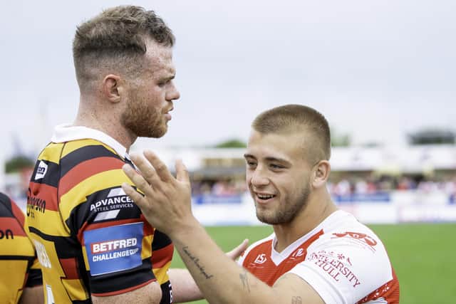 Joe Burgess shakes hands with Mikey Lewis following a game against Hull KR last year. (Photo: Allan McKenzie/SWpix.com)