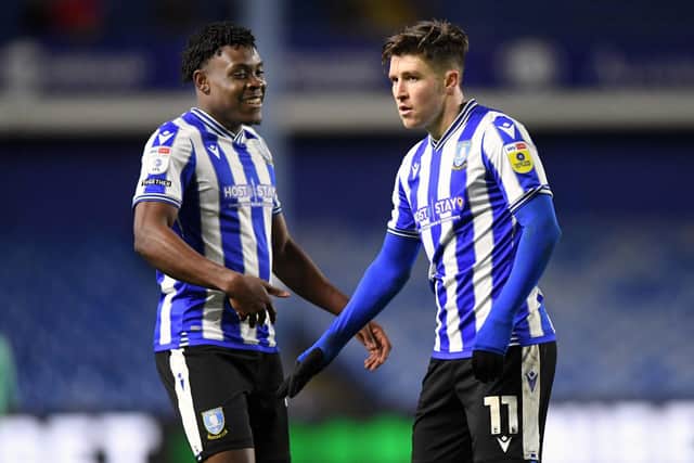 Still no smiles: Sheffield Wednesday's Josh Windass hits home his hat-trick goal and the teams fifth as Fisayo Dele-Bashiru joins him to celebrate (Picture: Steve Ellis)