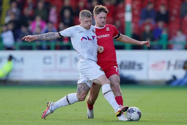 BACK IN THE FOLD: Jake Young - pictured in action for Swindon Town against Newport County earlier this season - has been recalled from his loan by parent club Bradford City. Picture : Jonathan Brady/PA