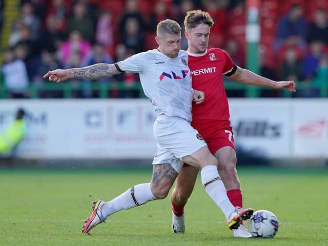 BACK IN THE FOLD: Jake Young - pictured in action for Swindon Town against Newport County earlier this season - has been recalled from his loan by parent club Bradford City. Picture : Jonathan Brady/PA